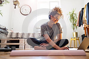 Young woman doing fitness exercise at home