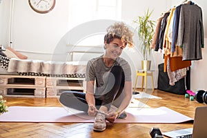 Young woman doing fitness exercise at home