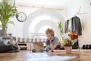 Young woman doing fitness exercise at home