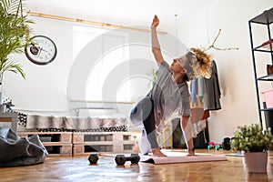 Young woman doing fitness exercise at home