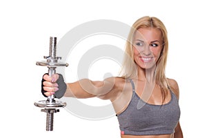 young woman doing a fitness workout with dumbbells