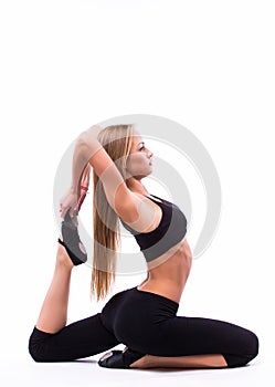 Young woman doing gymnastic exercise