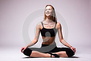 Young woman doing gymnastic exercise