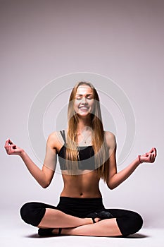 Young woman doing gymnastic exercise