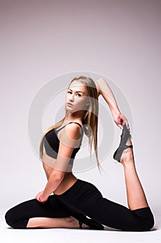 Young woman doing gymnastic exercise
