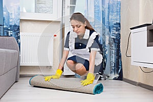 Young woman doing the housekeeping