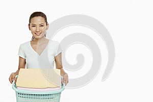 Young woman doing the laundry