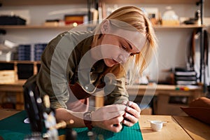 Young Woman doing Leatherwork