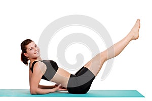 Young woman doing leg lift