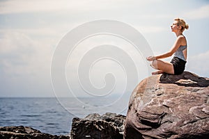 Young Woman doing Lotus Yoga Position
