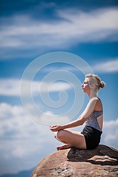 Young Woman doing Lotus Yoga Position