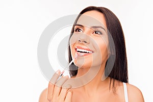 Young woman doing maquillage with lipstick, close up photo