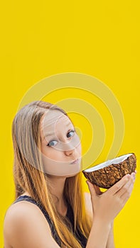 Young woman doing oil pulling over yellow background VERTICAL FORMAT for Instagram mobile story or stories size. Mobile