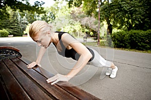 Young woman doing push ups