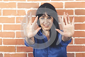 Young woman doing rejection pose