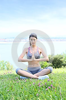 Young woman doing relaxation excercises outdoors