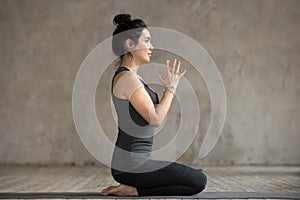 Young woman doing seiza exercise