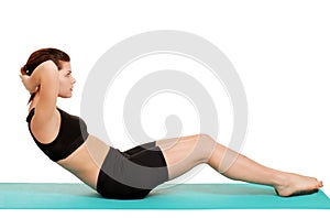 Young woman doing sit ups