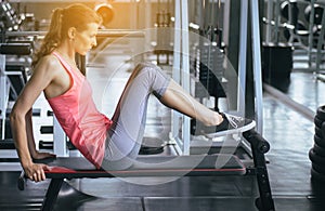 Young woman doing situp or crunches in gym,Female exercise muscular her stomach