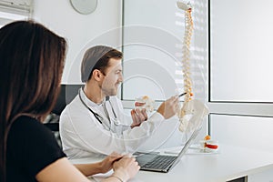 Young woman doing spine checkup at vertebra clinic