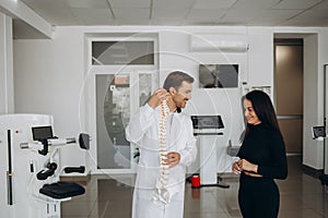 Young woman doing spine checkup at vertebra clinic