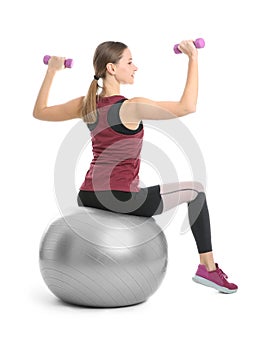 Young woman doing sports exercises isolated on white.