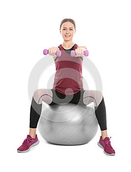 Young woman doing sports exercises isolated on white.