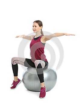 Young woman doing sports exercises isolated on white.