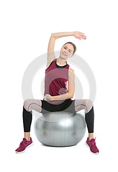 Young woman doing sports exercises on white. Home fitness