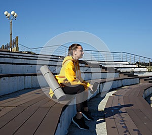young woman doing sports outdoors by the sea