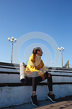 young woman doing sports outdoors by the sea