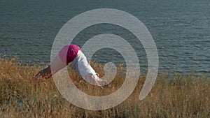 Young woman doing sports outdoors, yoga