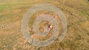 Young woman doing sports outdoors, yoga. aerial video