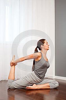 Young woman doing stretch exercise