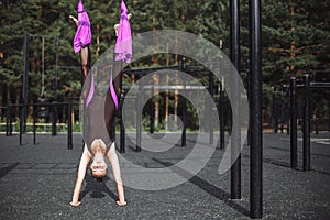 Young woman doing stretching outdoors. Fitness, stretch, balance, exercise and healthy lifestyle people.