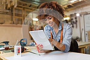 Young woman doing woodwork in a workshop