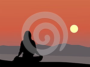 Young woman doing yoga on the beach