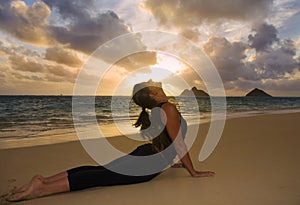 Young woman doing yoga at the beach