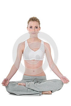 Young woman doing yoga, easy / Sukhasana position