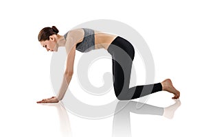 Young woman doing yoga exercise