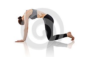 Young woman doing yoga exercise