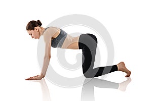 Young woman doing yoga exercise