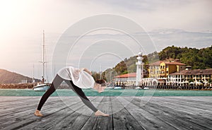 Young woman doing yoga exercise