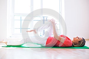 Young woman doing YOGA exercise at home