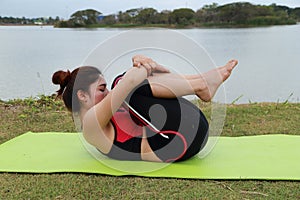 Young woman doing yoga exercise