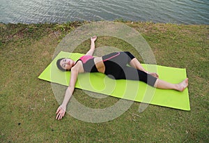 Young woman doing yoga exercise