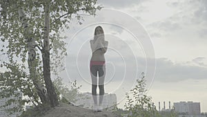 Young woman doing yoga exercise standing color profile Slog3