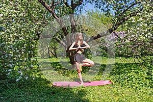 Young woman doing yoga exercises