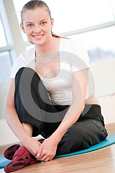 Young woman doing yoga exercises