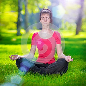 Young woman doing yoga exercises